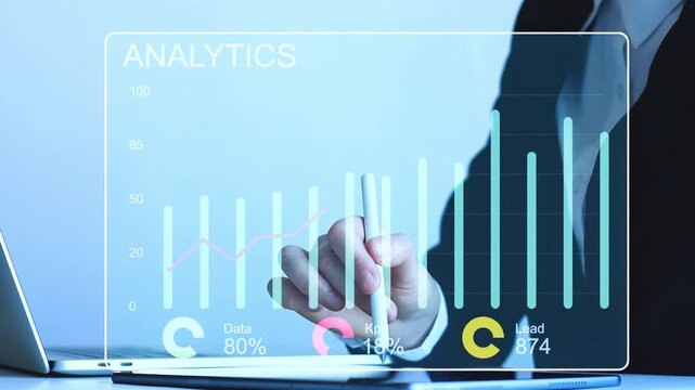 Business person analyzes data with chart on laptop screen in office setting during work hours.