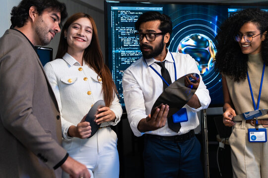 Team engineer analyze AI algorithm data on tablet screen and laptop. Engineer developer review artificial intelligence program code in semiconductor microchip wafer hardware laboratory