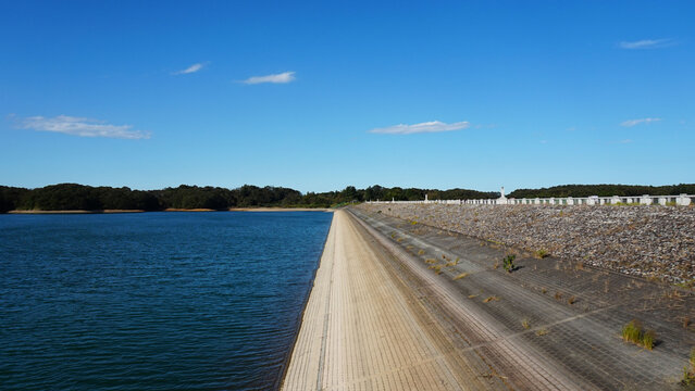 Sayama Lake and Yamaguchi Dam Under Blue Sky in Autumn
