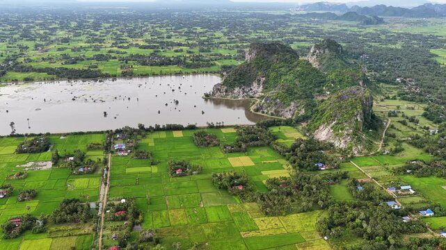 Beautiful rice fields next to limestone mountains in Kampot, Cambodia