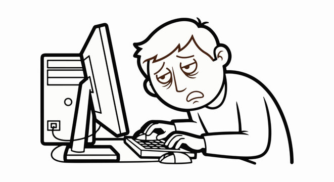 Frustrated young man working on desktop computer.