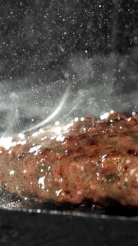 Beef burger is fried in a grill pan. Filmed on a high-speed camera at 1000 fps. High quality FullHD footage