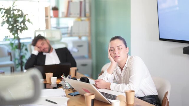 Tired office workers having nap while sitting in his workplace. High quality 4k footage