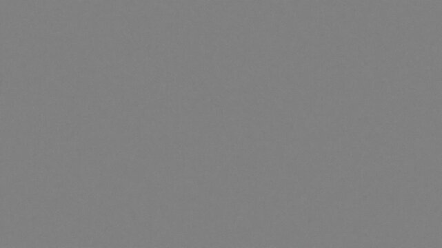 High-quality authentic 16mm film grain texture background for cinematic overlay and retro video grading