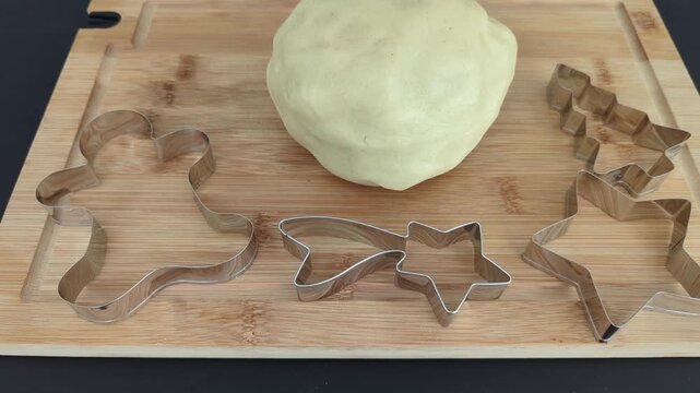 Preparing christmas cookies with dough and molds