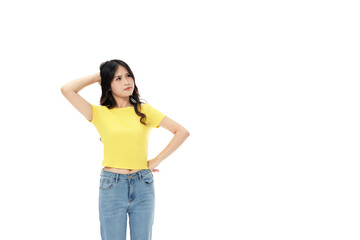 Fototapeta premium Thoughtful young woman standing with hand on hip