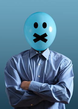Person with balloon head having mouth taped shut