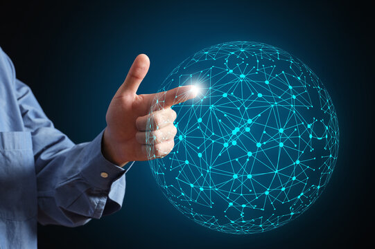 Hand touching glowing global network connecting points