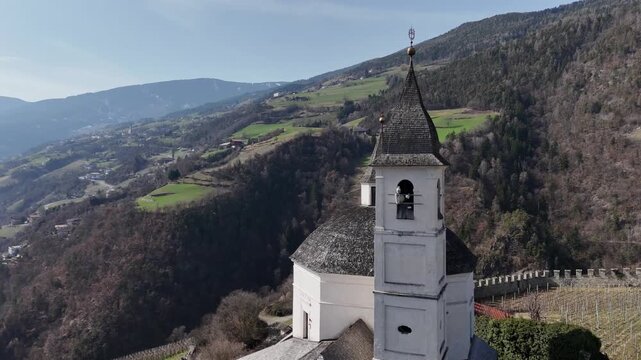 Orbital Drone Flight Around Church Dome Over Vineyards in Chiusa, South Tyrol, Italian Alps