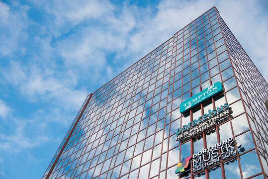 Dusseldorf, Germany, December 24, 2025, Modern office building facade with corporate signage in Dortmund, Germany.