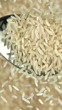 White rice falls from a spoon. Filmed on a high-speed camera at 1000 fps. High quality FullHD footage