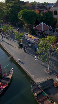 Aerial panoramic view of Hoi An city, Da Nang province, Vietnam. Pedicabs carrying tourists for sightseeing in the old town, UNESCO world heritage. One of the most travel popular touristic destination