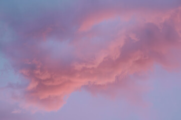 Fototapeta premium Final light of dusk in Lavender Ember sky with swirling cloud formations. 