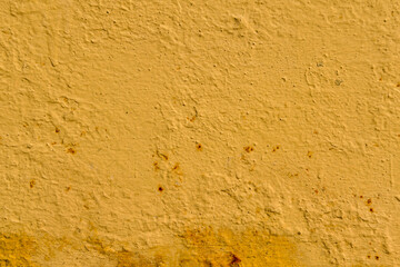 Rough textured yellow wall surface with rust spots © reddish