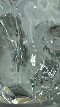 An aspirin tablet falls into a glass of water. Filmed on a high-speed camera at 1000 fps. High quality FullHD footage