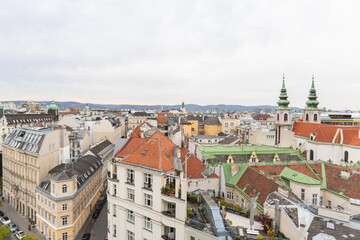 Obraz premium Vienna cityscape panorama with historic red rooftops and urban skyline view 