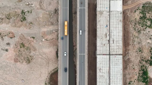Drone top-down of active highway and parallel infrastructure project