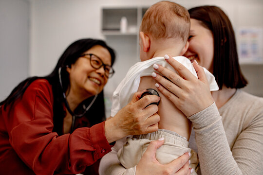 Doctor conducting routine paediatric check-up