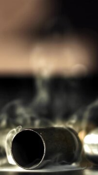 Smoke from the cartridge case after the shot. Filmed on a high-speed camera at 1000 fps. High quality FullHD footage