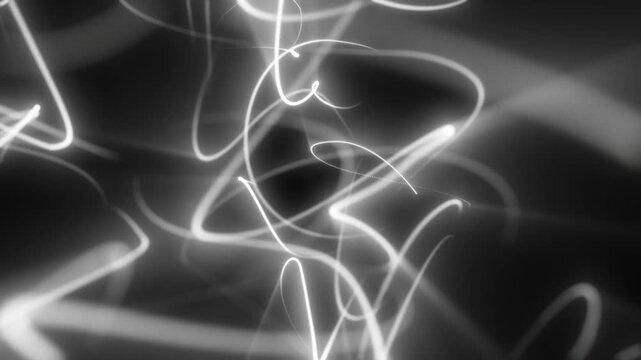 Monochrome abstract background with glowing white light scribbles and soft blur on a dark backdrop, creating a minimalist modern energy effect.