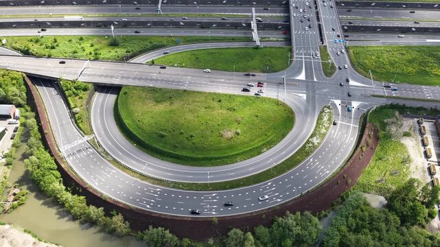 Aerial view of highway intersection traffic and modern road infrastructure
