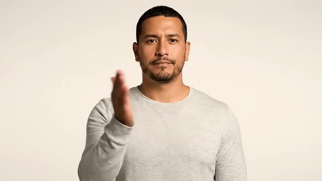 Man's hand showing a gesture of stop or halt, conveying a clear message of prevention and boundary setting