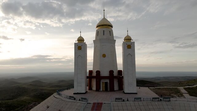 Drone close up view of the Adai Ata mausoleum on top of the sacred Mount Otpan Tau. The highest peak of Mangystau, an important historical and cultural complex of Kazakhstan. Architectural details