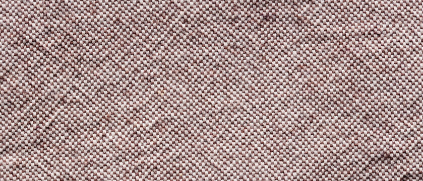 Mauve woven tweed fabric texture background with melange thread pattern for cozy rustic textile backdrop