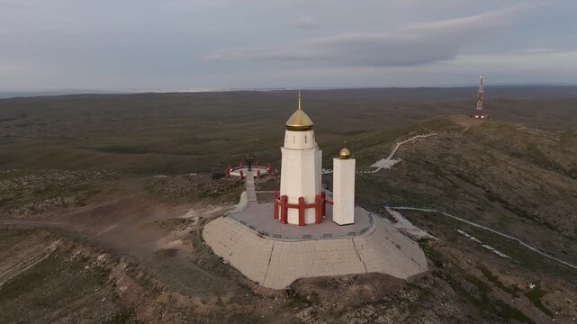 Drone close-up orbit around the Adai Ata mausoleum on the sacred Mount Otpan Tau. Panoramic view from all sides of the historical complex, the highest peak of Mangystau. Important cultural landmark 