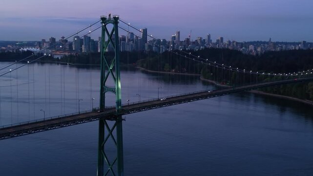Dawn Aerial shot of Lit Landmark Lions Gate bridge in Vancouver Canada