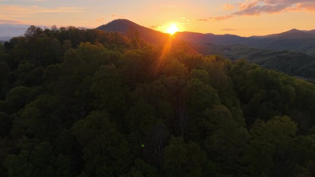 Aerial push in to sunset near boone nc over the appalachian mountains