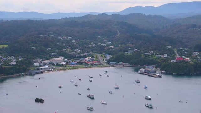 Oban town aerial cityscape with Stewart Island settlement and port in New Zealand.