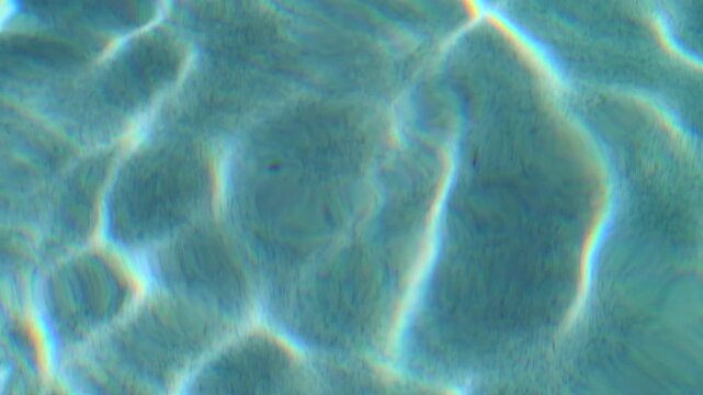 Shot in 1080p, 120fps. A macro shot of rippling pool water.