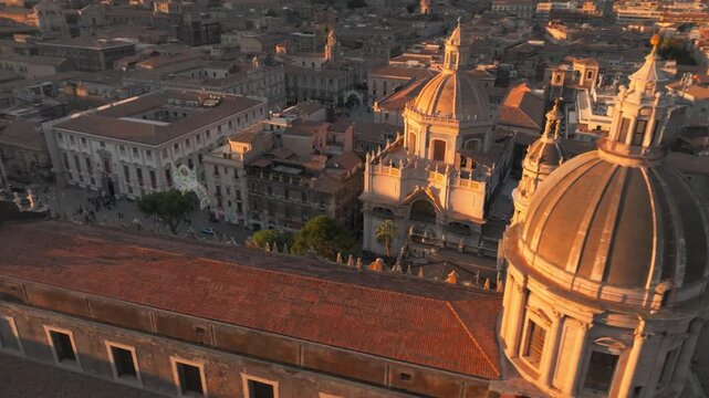 Drone Shot, Metropolitan Cathedral of Saint Agatha and Downtown Buildings of Catania, Sicily Italy at Sunset