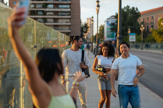 Group of friends taking a selfie enjoying city vacation