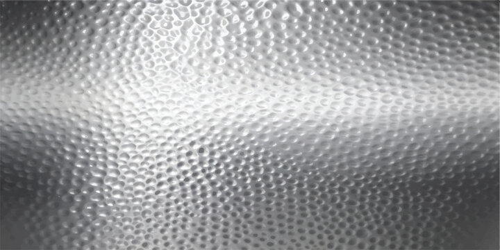 Close up of a reflective silver metal surface with a hammered texture hammered background metallic abstract industrial material backdrop reflective aluminum close up embossed geometric