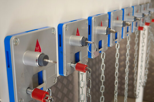 Close view of supermarket shopping cart locking system with keys and chains