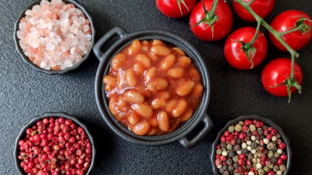 Beans in tomato sauce, a canned stew for the dinner table. Beans in tomato sauce as a food background for your design