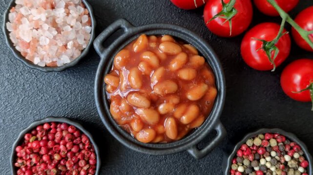 Beans in tomato sauce, a canned stew for the dinner table. Beans in tomato sauce as a food background for your design