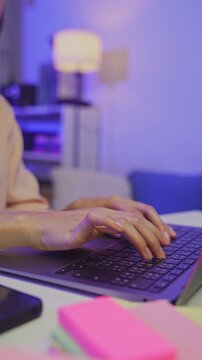 Hands typing on laptop keyboard on table, remote working and digital business technology concept.