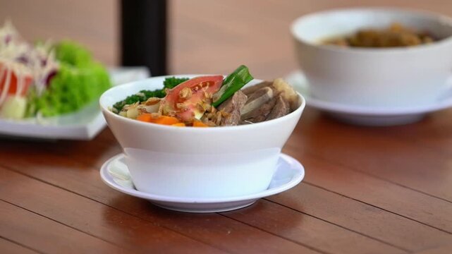 Delicious Indonesian Bakso Noodles with Vegetables and Meat in a Bowl.