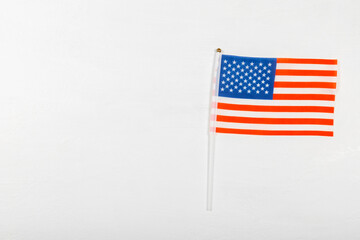 Fototapeta premium American flag on textured background. Memorial day, Independence Day and Veterans Day. American patriotism concept. Day of Remembrance and Honorary Banner. 4th of July celebration. Top view