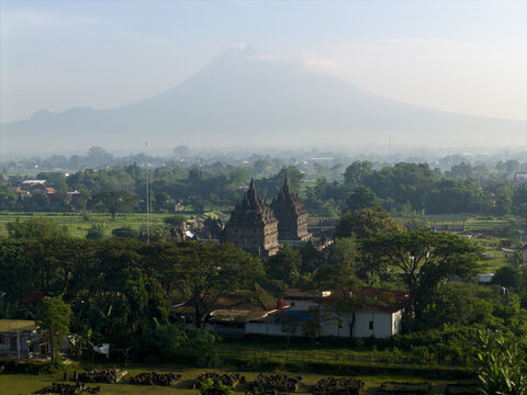 Aerial view of Plaosan Lor Temple and its twin stone shrines with Mount Merapi in the background in Kecamatan Prambanan, Jawa Tengah, Indonesia.