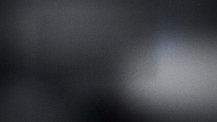 Dark gray grainy abstract texture with subtle light gradient and soft blurred highlights on smooth surface © Gra-fix PNG