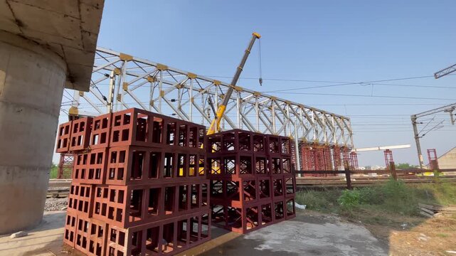 Construction Site with Steel Framework and Stacked Concrete Blocks of railway bridge