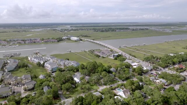 Lee Westbury Bridge over Folly River in Folly Beach, South Carolina with drone video moving in.