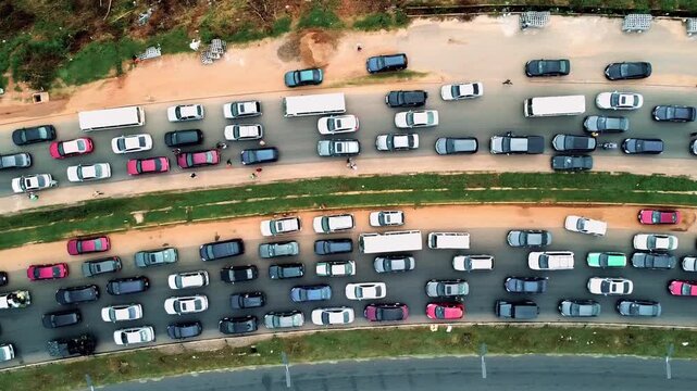 A visual journey from early morning sunrise into busy city traffic showing the daily rhythm of urban commuters and movement through crowded streets