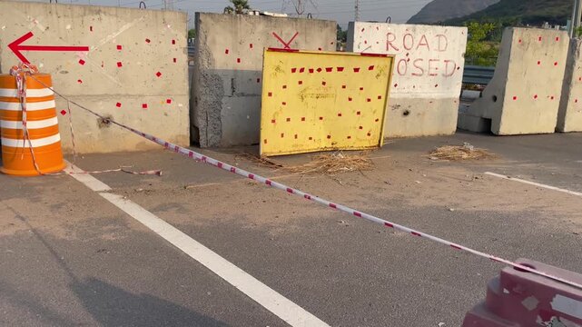 Concrete Road Barriers and Traffic Control Setup at Construction Zone