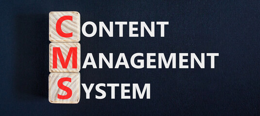 CMS content management system symbol. Concept words CMS content management system on beautiful wooden blocks. Beautiful black background. Business CMS content management system concept. Copy space. © Dzmitry