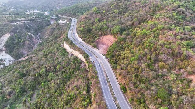 Drone reveal shot of remote mountain infrastructure in India.